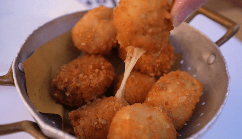 tasty fried balls filled with tomato sauce